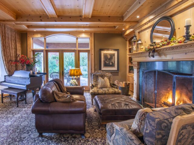 elegant living room with fireplace and piano